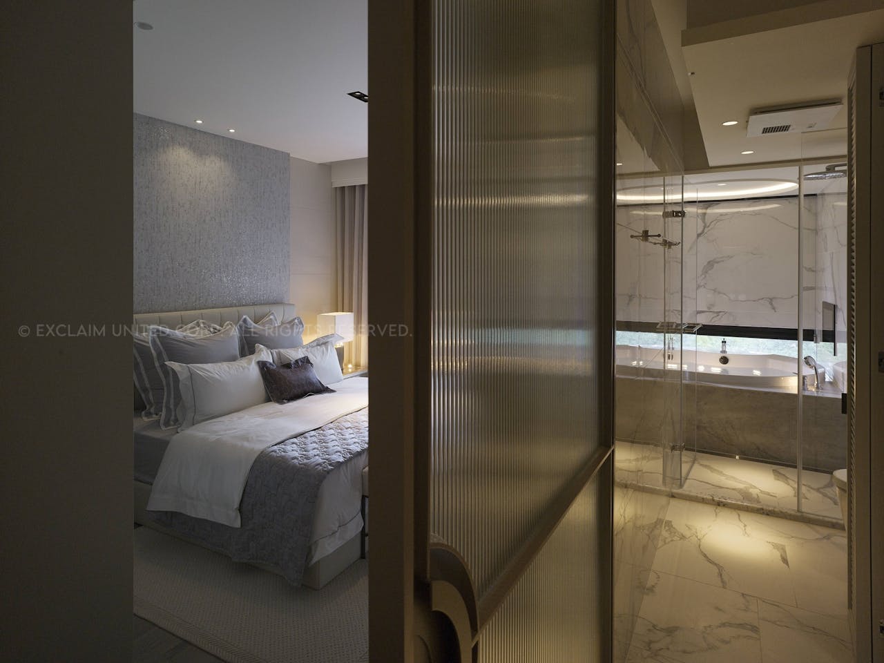 In the master bedroom and bath grays and blues create a serene sleeping environment.